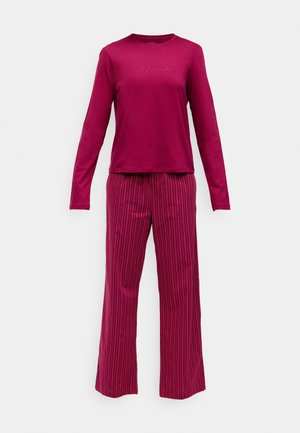 Calvin Klein loungewear set in deep pink. Long-sleeve top with logo, paired with striped, wide-leg pants. Soft fabric, relaxed fit.