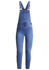 Denimöveralls i medelblå tvätt, med justerbara axelremmar, en framficka och slim-fit avsmalnande ben.