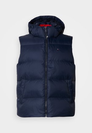 Navy puffer vest with a hood, zip closure, and two front pockets. Features quilted texture and a small logo on the chest.