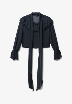 Blouse noire avec col volanté et long lien décoratif. Comprend des manches longues avec des poignets froncés. Fabriquée en tissu léger.