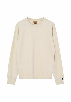 Krémszínű, hosszú ujjú, kerek nyakú pulóver bordázott mandzsettákkal és szegéllyel, jobboldali ujjmandzsettán kis fekete logócímkével.