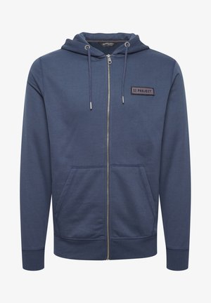 Navy zip-up hoodie made of cotton blend, featuring a front pocket, adjustable drawstring hood, and a fabric logo patch on the chest.