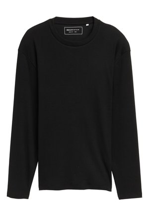 Black long-sleeve shirt made of ribbed cotton, featuring a round neckline and relaxed fit, with minimal branding label at the neck.