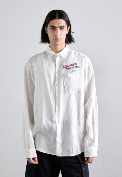 White button-up shirt made of lightweight fabric, featuring colorful embroidered text. Loose fit with a pocket on the left chest.