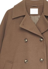 Brown double-breasted wool coat with wide lapels, four buttons, and a sewn-in collar tag reading "NA-KD."