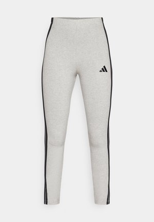 Gray high-waisted leggings with black side stripes, made of soft fabric. Features a small black Adidas logo on the front.
