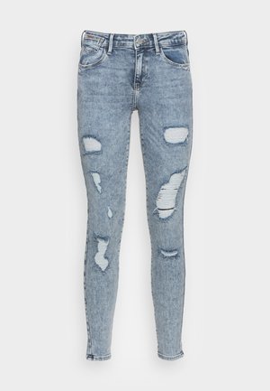 Lichtblauwe versleten skinny jeans met scheuren op de knieën en bovenbenen, met een klassieke vijf-pocketontwerp en een ritsluiting.
