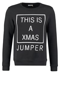 Czarna bluza z białym blokowym napisem "TO JEST ŚWIĄTECZNY SWETER." Posiada okrągły dekolt i długie rękawy.