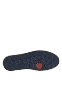 Semelle en caoutchouc bleu marine avec un motif de grip texturé, comportant un accent circulaire rouge au centre et un bord beige pour le contraste.