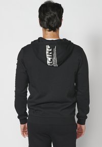 Koroshi Felpa con zip - black