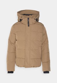 Brun puffjacka med dragkedja fram, hög krage, justerbar huva och sidofickor. Den har en quiltad design och elastiska muddarna.