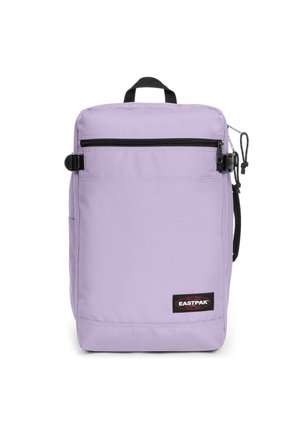 Purple fabric backpack featuring a front zippered pocket, adjustable strap, side pocket, and a branded label at the bottom.