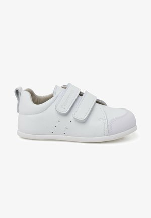 White leather children's shoes with two Velcro straps, rounded toe, rubber sole, and perforated detailing for breathability.