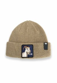 Beige knitted beanie with folded cuff, featuring a patch of a white goat head on navy background and a small black tag on the side.