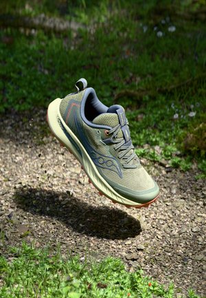 Lightweight running shoe in olive green mesh; features orange accents, textured sole, and cushioned collar. Ideal for outdoor terrains.