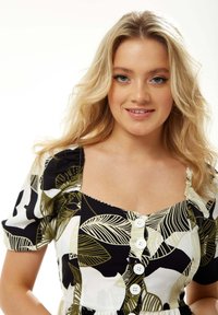 Floral-patterned dress featuring short puff sleeves, a square neckline, and white buttons down the front, with green and black leaf motifs.