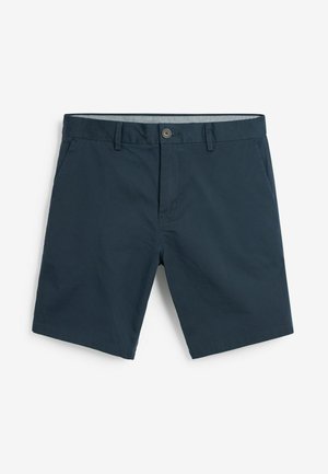 Granatowe szorty wykonane z tkaniny plecionej, z zapięciem na guziki, usztywnionym paskiem w talii i kieszeniami bocznymi, o gładkiej fakturze.