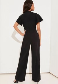 Lipsy FLUTTER SLEEVE V NECK - Tuta jumpsuit - black