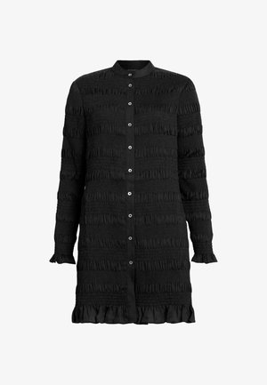 Black dress with smocked texture, long sleeves, and ruffled hem. Features a collar and front button closure with shiny metal buttons.