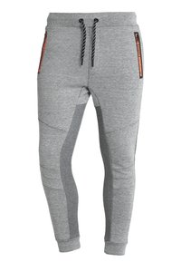Grijze joggingsbroek van zachte stof, met een tapered fit, elastische tailleband met trekkoord en ritszakken aan de zijkanten.