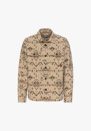 Beige flanellen overhemd met geometrische bruine patronen, voorzien van twee borstzakken, knoopsluiting en een klassiek kraagontwerp.