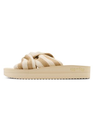 Slide sandal with a knotted, striped beige and cream fabric upper. Thick, textured rubber sole in a light beige color with serrated edges.