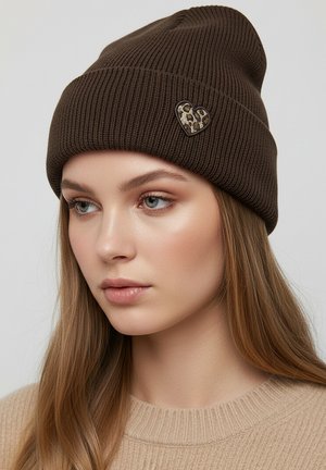 Brown knit beanie with ribbed texture and a leopard-print heart-shaped patch accent. Soft, warm material with a snug design.