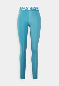 Nike Pro leggings i teal, med en bred midja i blått och vitt med 'NIKE PRO'-logotyp, slät textur och figurnära design.