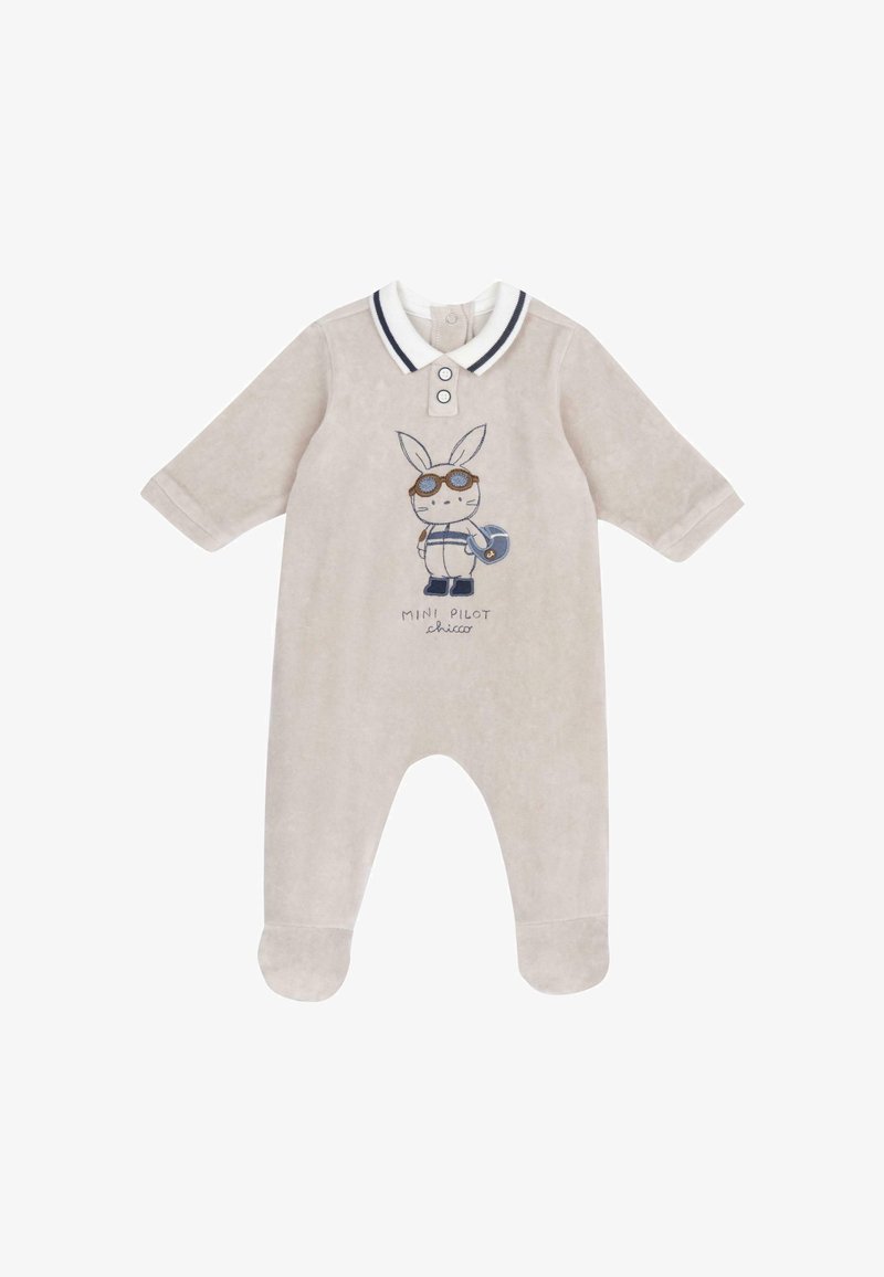 Grenouillère beige pour bébé avec pieds, col blanc à rayures foncées, et un pilote lapin de dessin animé tenant un casque brodé sur la poitrine.