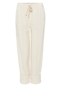 Pantalon en velours côtelé couleur crème avec ceinture élastique, cordon de serrage et manches retroussées, présenté sur fond blanc.