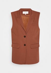 Brun ärmlös blazer i texturerad tyg med svarta knappar, två framfickor och en slät innerfoder.