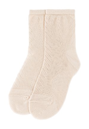 Par de calcetines beige hasta el tobillo, tejidos con un sutil patrón diagonal y puños acanalados.
