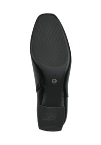 Black leather shoe sole with a smooth surface, textured grip pattern, and embossed logo. Features a rounded toe and zipper detail.