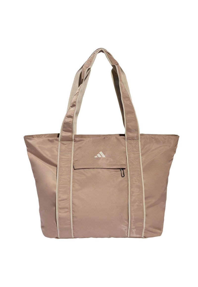Saco tote de nylon rosa claro com detalhes bege, com duas alças e um bolso frontal, logótipo da marca acima do bolso, textura suave.