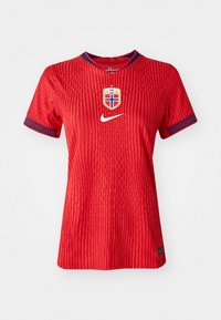 Red Nike jersey with textured stripes, round neckline, blue accents on sleeves, and Norway national team crest on the chest.