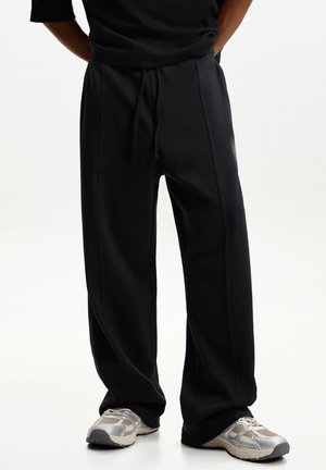 Pantalones deportivos - black