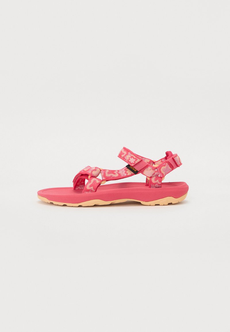 Sandal de cor-de-rosa com tiras em padrão floral, fechos ajustáveis de fita aderente, palmilha contornada e sola de borracha leve.