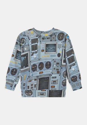 Sweatshirt avec un motif intégral représentant des instruments de cockpit d'avion détaillés, des jauges, des écrans, des boutons et des cadrans dans des tons bleu-gris.