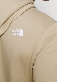 The North Face Felpa con cappuccio - beige