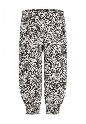 Voľné nohavice s čierno-bielym zvieracím vzorom, s elastickým pásom a naťahovacími manžetami.