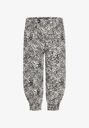 Voľné nohavice s čierno-bielym zvieracím vzorom, s elastickým pásom a naťahovacími manžetami.