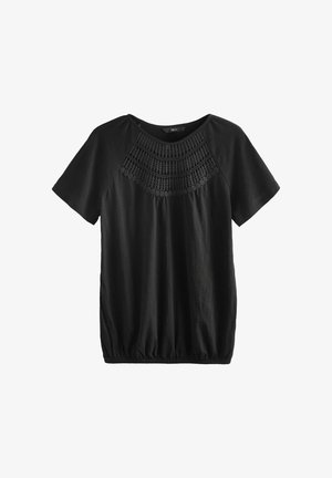 Top nero a maniche corte con vita arricciata. Presenta un design testurizzato simile all'uncinetto lungo il collo. Realizzato in materiale morbido e leggero.