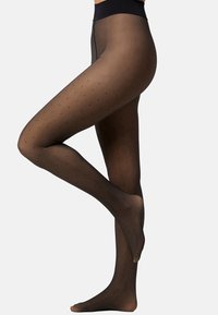 Black sheer tights with small black polka dots, a solid waistband, and a smooth texture, showcasing a fitted leg design.