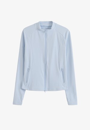 Light blue long-sleeve zip-up jacket with stand collar and zippered side pockets, designed with panel seams for a fitted look.