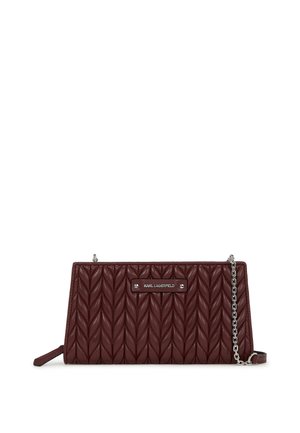 Quilted burgundy leather bag with a silver chain strap and logo plaque. Features a rectangular shape and textured pattern.