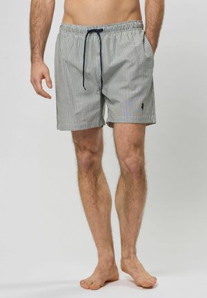 Badeshorts im gestreiften Blau- und Weißmuster, elastischer Bund mit Kordelzug, seitliche Taschen und kleines Logo auf der unteren linken Seite.