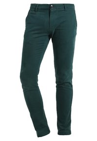 Mörkgröna slim-fit byxor med framfickor, knappstängning och bältesöggor; tillverkade av mjukt, strukturerat bomullsmaterial.