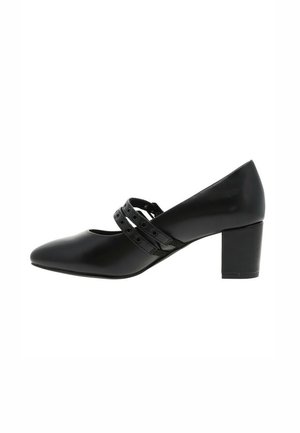 Chaussure à talon haut noire avec un bout pointu, ornée de deux sangles décoratives avec des découpes circulaires et un talon bloc. Fini en simili cuir lisse.