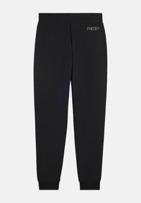 Pantalons de survêtement noirs en tissu doux, avec une taille élastique et des poignets. Le nom de la marque "FREDDY" est brodé sur le côté.
