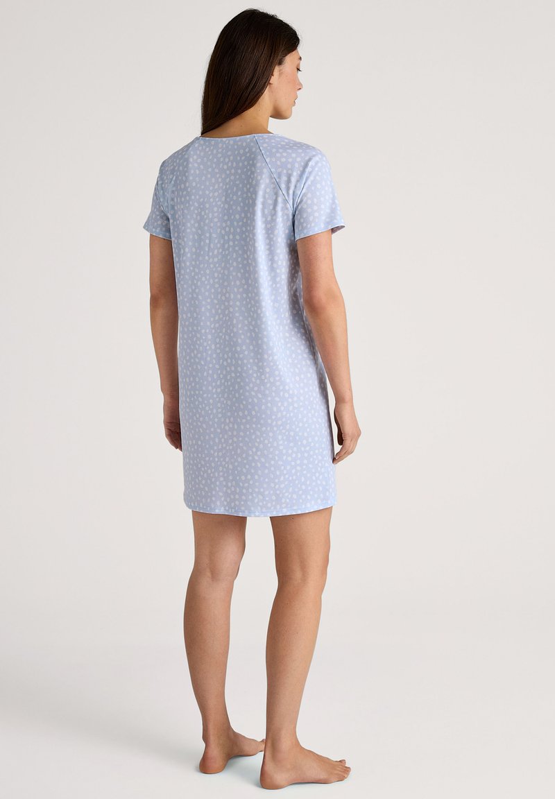Light blue short-sleeved nightgown featuring a subtle white dot pattern, knee-length design, and round neckline. Smooth fabric texture.